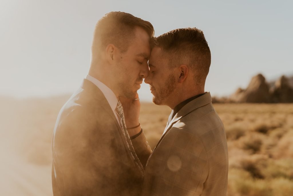 Two guys post for a photo together.